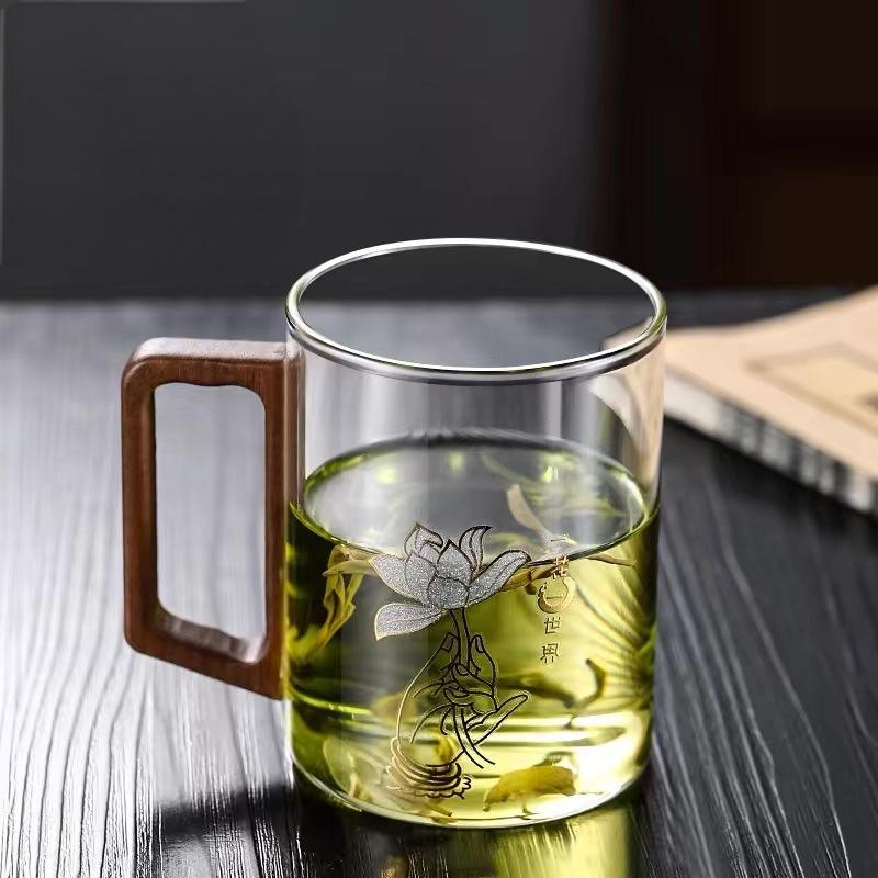 High end green tea cup with walnut handle and lid. High temperature resistant glass office drinking cup